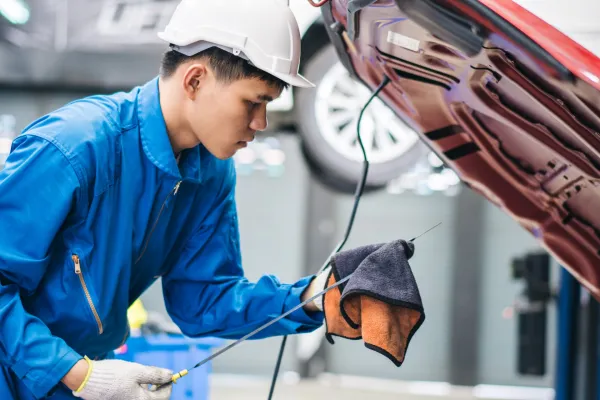 asian-male-mechanic-checking-oil-level-in-the-car-2026-01-08-06-52-51-utc-699874c0ebbd1