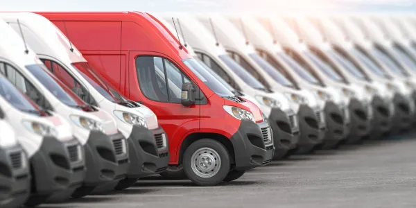 red-delivery-van-in-a-row-of-white-vans-best-expr-2026-01-09-00-44-05-utc-69987b5dd2cff